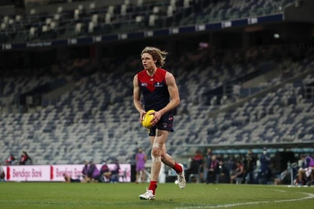 Ben Brown of the Demons runs in to kick the ball during the 2021 AFL Round 23 match between the Geelong Cats and the Melbourne Demons at GMHBA...