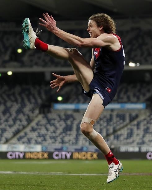 Ben Brown of the Demons kicks the ball during the 2021 AFL Round 23 match between the Geelong Cats and the Melbourne Demons at GMHBA Stadium on...