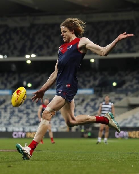 Ben Brown of the Demons kicks the ball during the 2021 AFL Round 23 match between the Geelong Cats and the Melbourne Demons at GMHBA Stadium on...