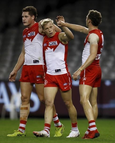 Isaac Heeney of the Swans celebrates a goal with Hayden McLean of the Swans and Will Hayward of the Swans during the 2021 AFL Round 23 match between...