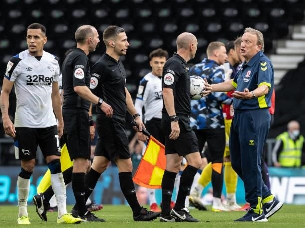 Middlesbrough's Neil Warnock speaks to referee Andy Davies at the end of the match during the Sky Bet Championship match between Derby County and...