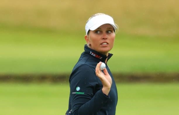 Nanna Koerstz Madsen of Denmark waves as she finishes her round at the 18th hole during Day Three of the AIG Women's Open at Carnoustie Golf Links on...