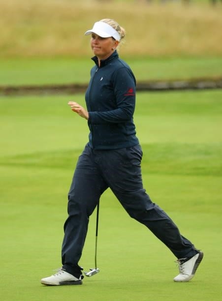 Nanna Koerstz Madsen of Denmark waves as she finishes her round at the 18th hole during Day Three of the AIG Women's Open at Carnoustie Golf Links on...