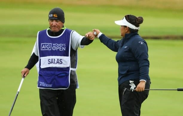 Lizette Salas of United States fist bumps with her caddie as she finishes her round at the 18th hole during Day Three of the AIG Women's Open at...