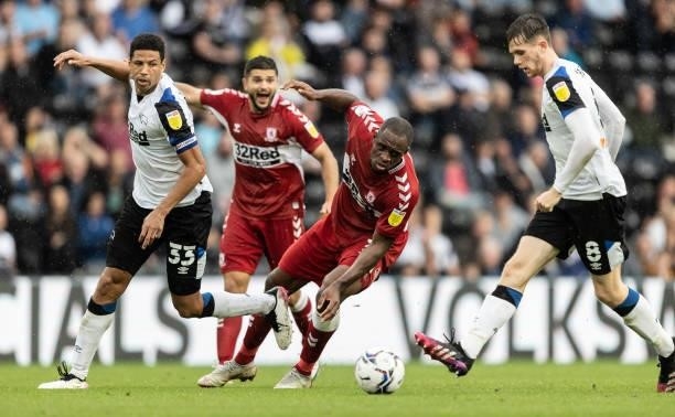 Middlesbrough's Uche Ikpeazu competing with Derby County's Max Bird during the Sky Bet Championship match between Derby County and Middlesbrough at...