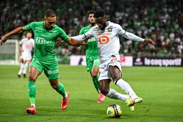 Ryad BOUDEBOUZ of Saint Etienne and Jonathan BAMBA of Lille during the French Ligue 1 Uber Eats soccer match between Saint Etienne and Lille at Stade...