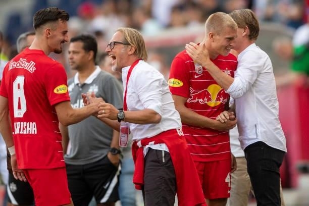 Mergim Berisha, press officer Christian Kircher, Rasmus Kristensen and sports director Christoph Freund of FC Red Bull Salzburg celebrate after the...
