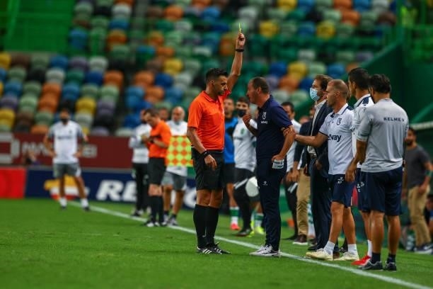 Referee Manuel Oliveira show a yellow card to Petit of Belenenses SAD during the Liga Bwin between Sporting CP and Belenenses SAD at Estadio Jose...