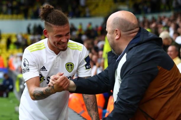 Kalvin Phillips of Leeds United greets a fan after the Premier League match between Leeds United and Everton at Elland Road on August 21, 2021 in...