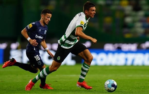 Joao Palhinha of Sporting CP with Afonso Sousa of Belenenses SAD in action during the Liga Bwin match between Sporting CP and Belenenses SAD at...