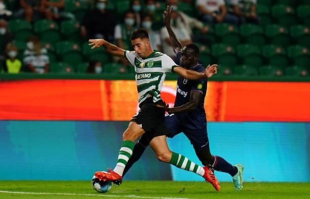 Goncalo Inacio of Sporting CP with Alioune Ndour of Belenenses SAD in action during the Liga Bwin match between Sporting CP and Belenenses SAD at...