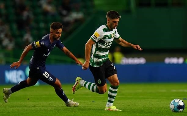 Ruben Vinagre of Sporting CP with Chico Teixeira of Belenenses SAD in action during the Liga Bwin match between Sporting CP and Belenenses SAD at...