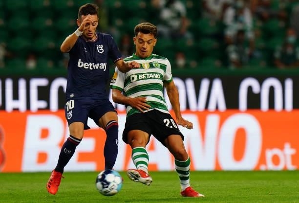 Pedro Goncalves of Sporting CP with Afonso Sousa of Belenenses SAD in action during the Liga Bwin match between Sporting CP and Belenenses SAD at...