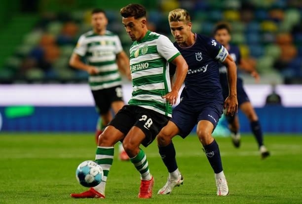 Pedro Goncalves of Sporting CP with Tomas Ribeiro of Belenenses SAD in action during the Liga Bwin match between Sporting CP and Belenenses SAD at...