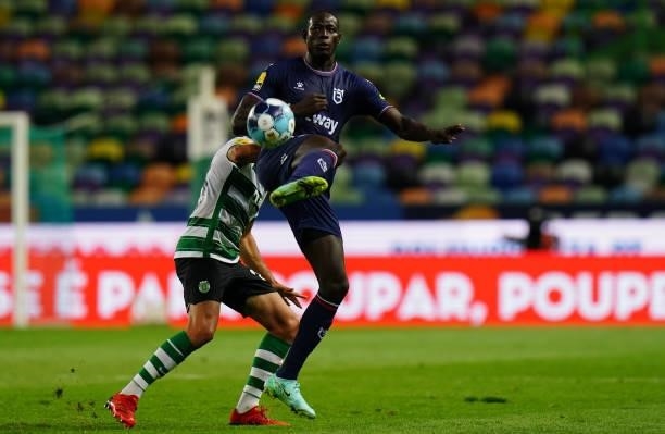 Alioune Ndour of Belenenses SAD with Goncalo Inacio of Sporting CP in action during the Liga Bwin match between Sporting CP and Belenenses SAD at...