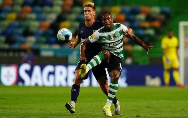 Jovane Cabral of Sporting CP with Tomas Ribeiro of Belenenses SAD in action during the Liga Bwin match between Sporting CP and Belenenses SAD at...
