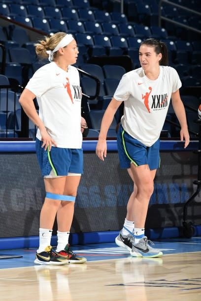 Rachel Banham and Bridget Carleton of the Minnesota Lynx warm up before the game against the Chicago Sky on August 21, 2021 at the Wintrust Arena in...