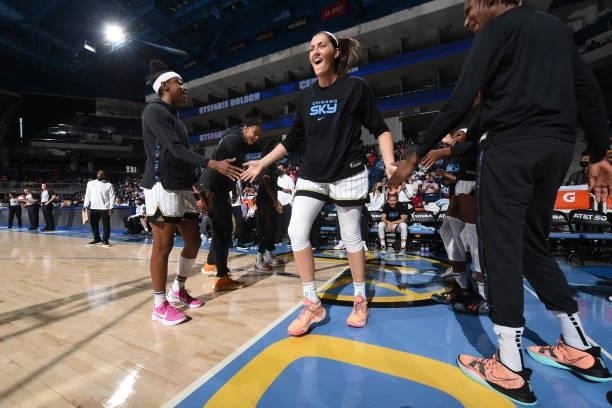 Stefanie Dolson of the Chicago Sky high fives teammates before the game against the Minnesota Lynx on August 21, 2021 at the Wintrust Arena in...