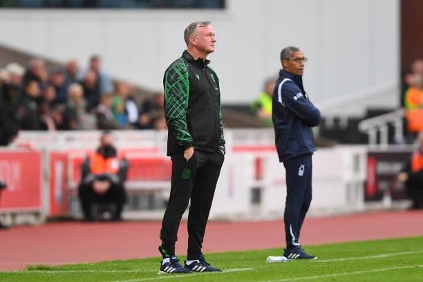 Michael O'Neill, manager of Stoke City and Nottingham Forest manager, Chris Hughton during the Sky Bet Championship match between Stoke City and...