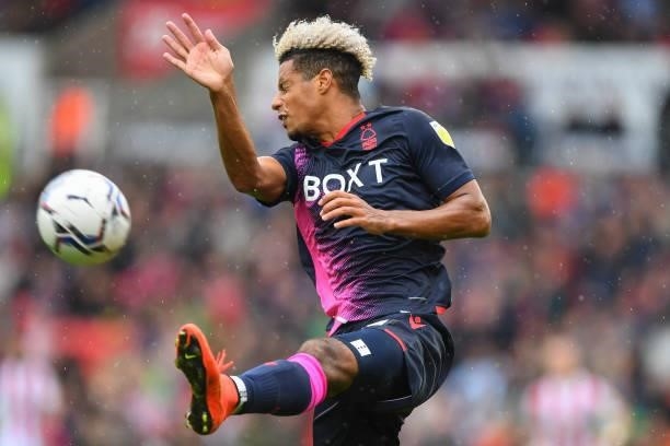 Lyle Taylor of Nottingham Forest attempts to block the ball during the Sky Bet Championship match between Stoke City and Nottingham Forest at the...
