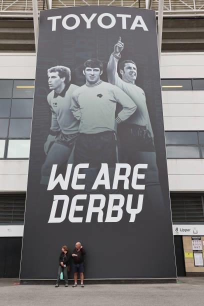 Fans wait for the gates to open in front of some Toyota advertising ahead of the Sky Bet Championship match between Derby County and Middlesbrough at...