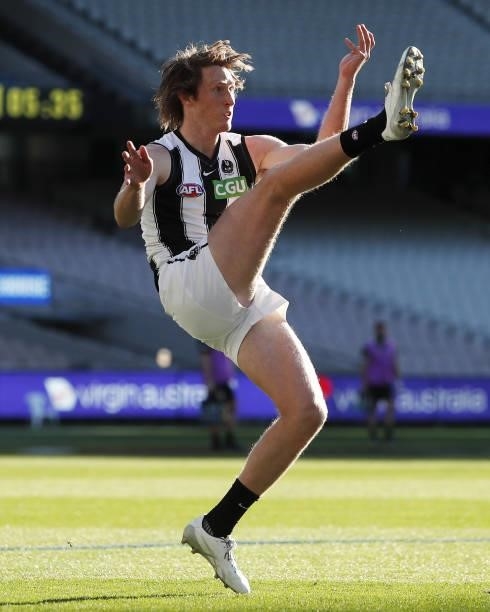 Nathan Murphy of the Magpies kicks the ball during the 2021 AFL Round 23 match between the Essendon Bombers and the Collingwood Magpies at the...