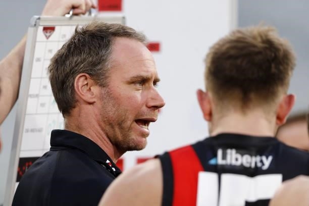 Ben Rutten, Senior Coach of the Bombers addresses his players during the 2021 AFL Round 23 match between the Essendon Bombers and the Collingwood...