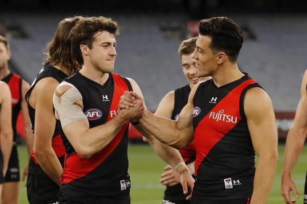 Andrew McGrath of the Bombers celebrates with Dylan Shiel of the Bombers during the 2021 AFL Round 23 match between the Essendon Bombers and the...