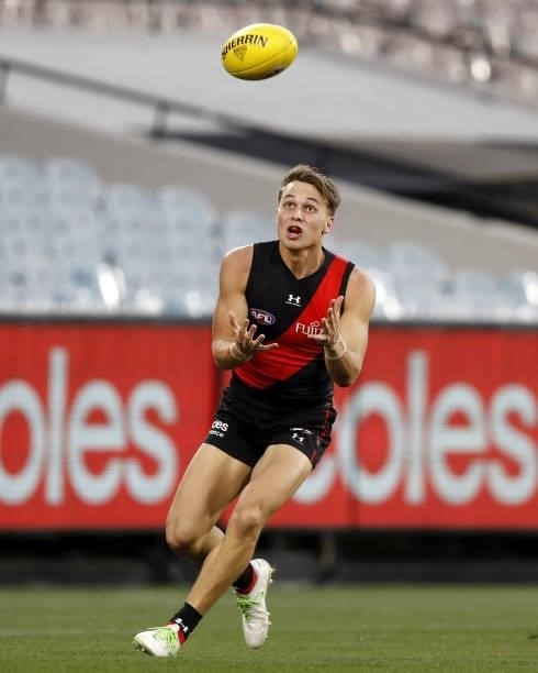 Dylan Clarke of the Bombers marks the ball during the 2021 AFL Round 23 match between the Essendon Bombers and the Collingwood Magpies at the...