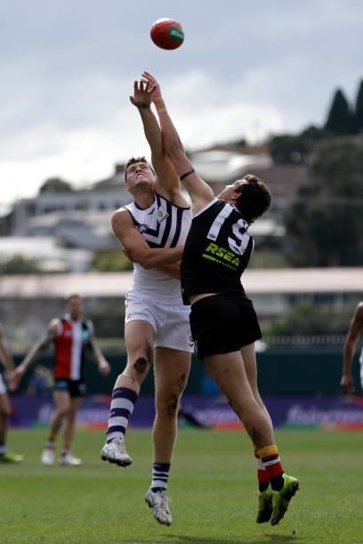 Lloyd Meek of the Dockers and Rowan Marshall of the Saints compete in a ruck contest during the 2021 AFL Round 23 match between the St Kilda Saints...
