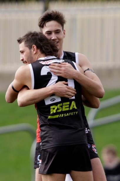 Cooper Sharman of the Saints celebrates a goal with Ben Long of the Saints during the 2021 AFL Round 23 match between the St Kilda Saints and the...