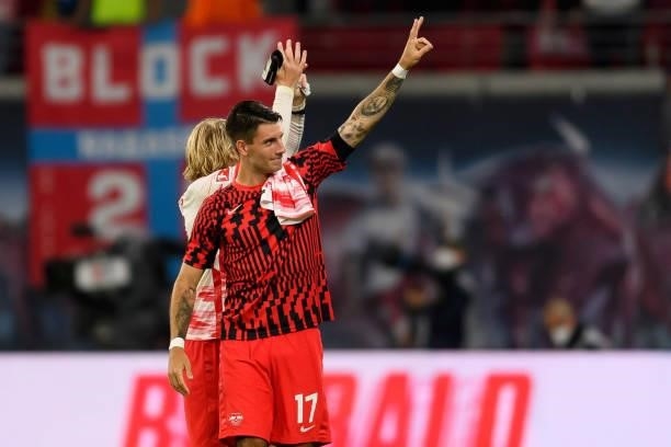 Dominik Szobiszlai of RB Leipzig celebrate after winning during the Bundesliga match between RB Leipzig and VfB Stuttgart at Red Bull Arena on August...