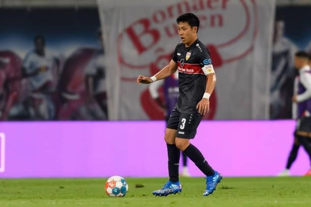 Wataru Endo of VfB Stuttgart controls the ball during the Bundesliga match between RB Leipzig and VfB Stuttgart at Red Bull Arena on August 20, 2021...