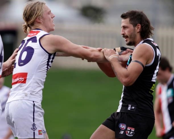 Hayden Young of the Dockers wrestles with Ben Long of the Saints during the 2021 AFL Round 23 match between the St Kilda Saints and the Fremantle...