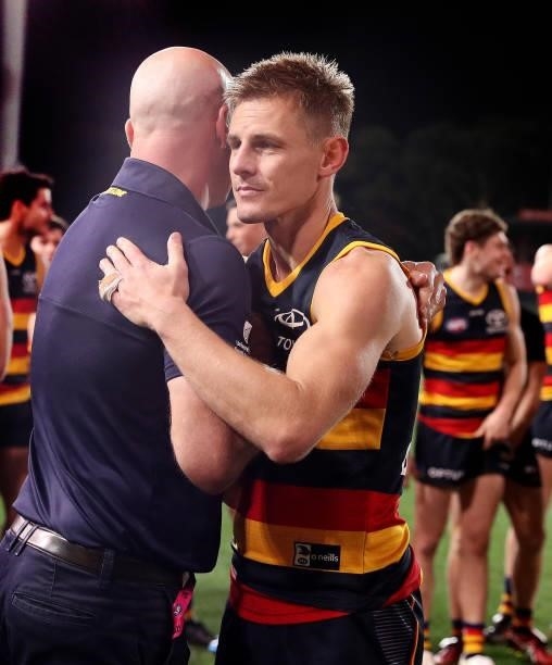 Retiring David Mackay hugs coach Matthew Nicks during the 2021 AFL Round 23 match between the Adelaide Crows and the North Melbourne Kangaroos at...