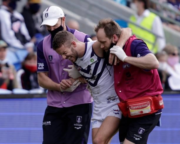 Sam Switkowski of the Dockers leaves the field injured during the 2021 AFL Round 23 match between the St Kilda Saints and the Fremantle Dockers at...