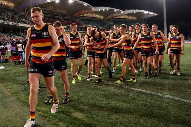 Tom Lynch of the Crows leads his team off after this last game during the 2021 AFL Round 23 match between the Adelaide Crows and the North Melbourne...