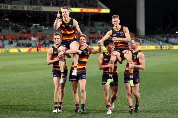 Tom Lynch and David Mackay of the Crows are chaired off after their last game for the club during the 2021 AFL Round 23 match between the Adelaide...