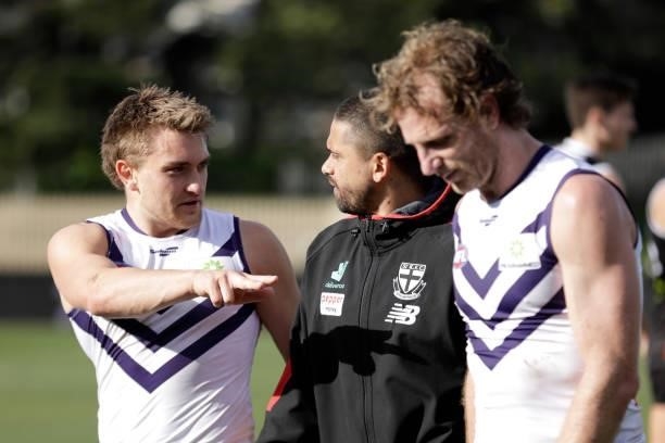 Mitch Crowden of the Dockers talk with Bradley Hill of the Saints after the 2021 AFL Round 23 match between the St Kilda Saints and the Fremantle...