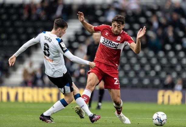 Middlesbrough's Matt Crooks competing with Derby County's Max Bird during the Sky Bet Championship match between Derby County and Middlesbrough at...