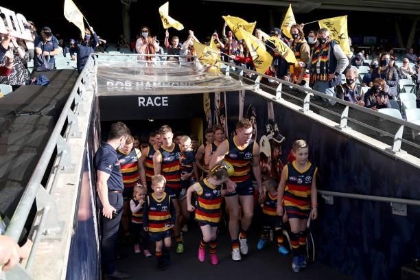 Tom Lynch and David Mackay of the Crows lead their team out for the last time during the 2021 AFL Round 23 match between the Adelaide Crows and the...