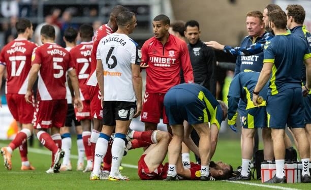 Middlesbrough's Jonathan Howson lies injured after a tackle by Derby County's Phil Jagielka during the Sky Bet Championship match between Derby...