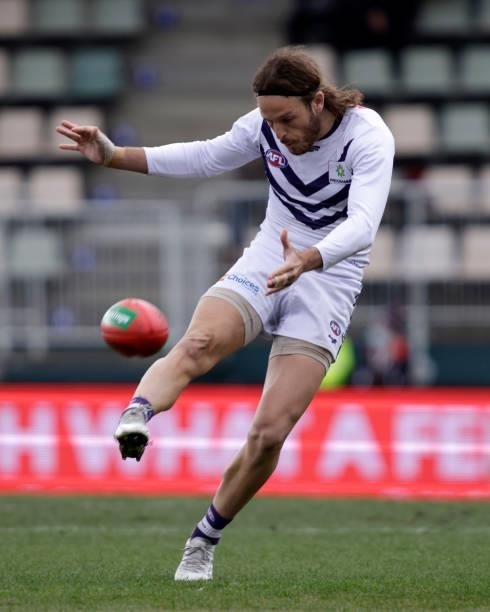 James Aish of the Dockers kicks the ball during the 2021 AFL Round 23 match between the St Kilda Saints and the Fremantle Dockers at Blundstone Arena...