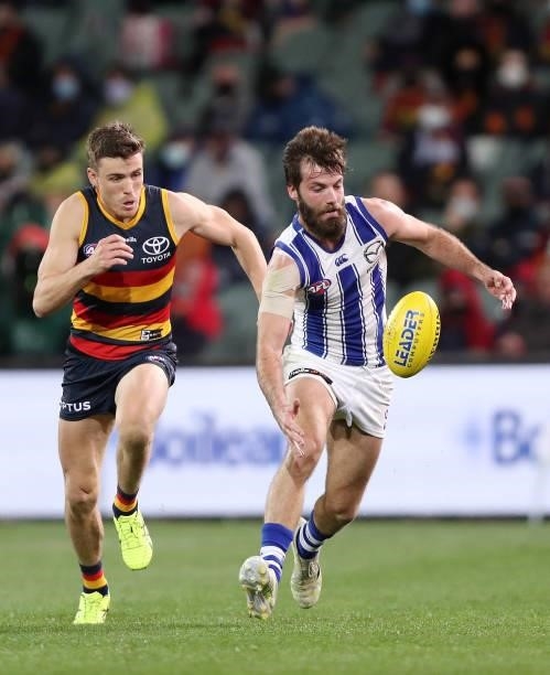 Luke McDonald of the Kangaroos and Paul Seedsman of the Crows during the 2021 AFL Round 23 match between the Adelaide Crows and the North Melbourne...