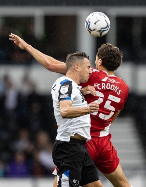 Middlesbrough's Matt Crooks competing with Derby County's Phil Jagielka during the Sky Bet Championship match between Derby County and Middlesbrough...