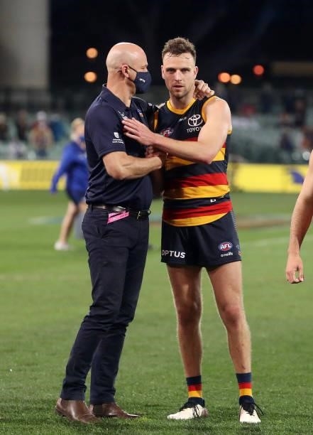 Matthew Nicks, Senior Coach of the Crows with Brodie Smith after the game during the 2021 AFL Round 23 match between the Adelaide Crows and the North...