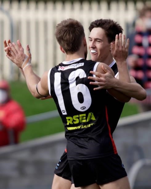 Caleb Sharman of the Saints and Dan Butler of the Saints celebrates a goal during the 2021 AFL Round 23 match between the St Kilda Saints and the...