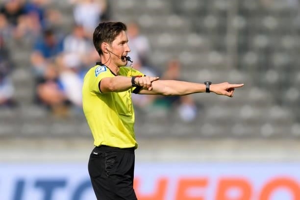 Referee Dr. Matthias Joellenbeck gestures during the Bundesliga match between Hertha BSC and VfL Wolfsburg at Olympiastadion on August 21, 2021 in...