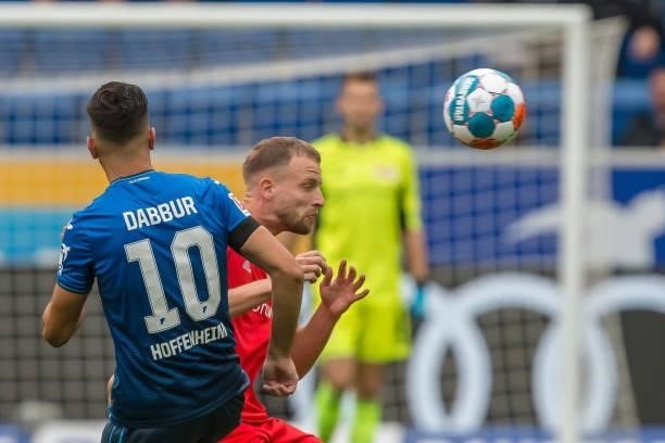 Munas Dabbur of TSG 1899 Hoffenheim and Marvin Friedrich of 1.FC Union Berlin battle for the ball during the Bundesliga match between TSG Hoffenheim...