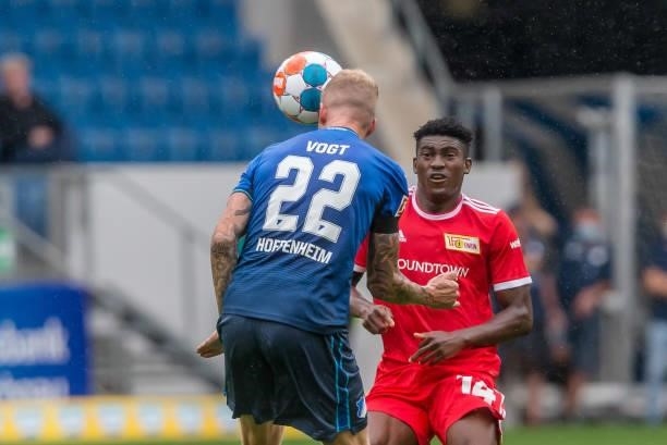 Kevin Vogt of TSG 1899 Hoffenheim and Taiwo Awoniyi of 1.FC Union Berlin battle for the ball during the Bundesliga match between TSG Hoffenheim and...